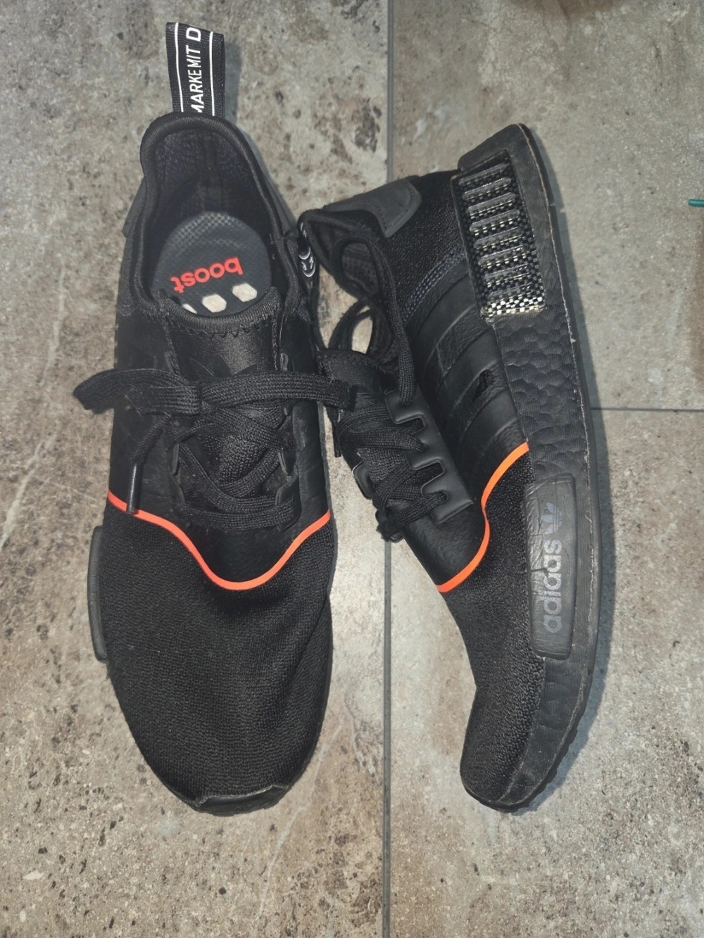 - adidas Men’s Black Athletic Sneakers with Orange Trim